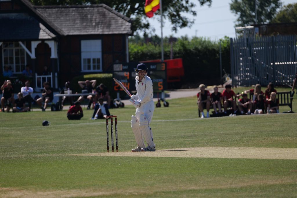 A pupil batting during a cricket match