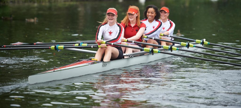 A crew rowing on the river
