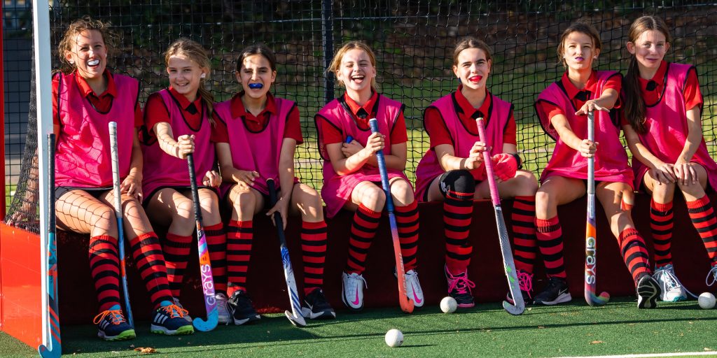 Pupils in team kit lined up before a fixture