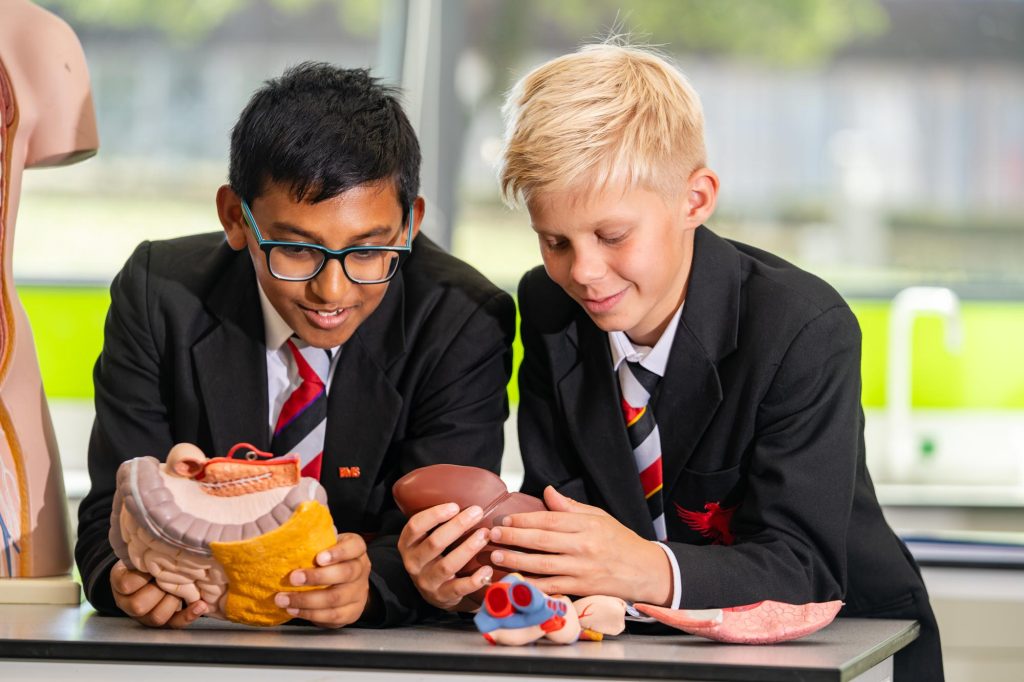 Two pupils talking over lunch